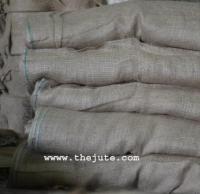 Hessian cloth in stacks before stitching